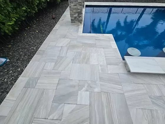 Leathered marble pool deck restoration in Palm Beach